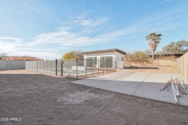 back of house with a patio area and a fenced backyard