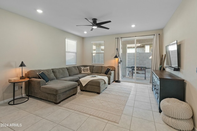 tiled living room with ceiling fan