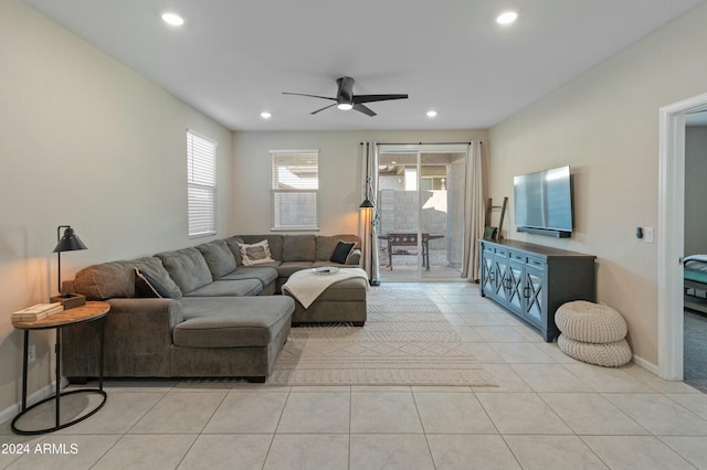 living room featuring ceiling fan and light tile patterned floors