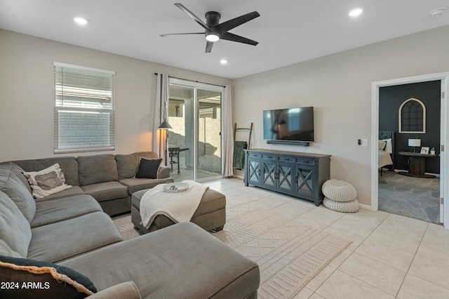 tiled living room with ceiling fan