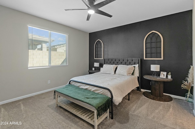 bedroom with ceiling fan and carpet floors