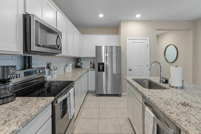 kitchen featuring sink, white cabinetry, and stainless steel appliances