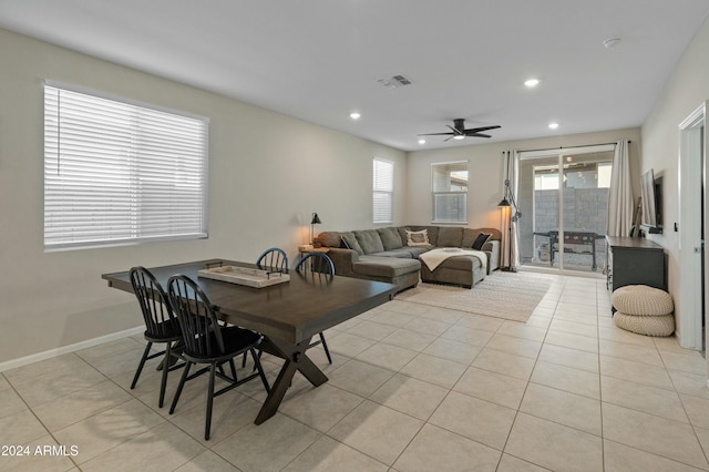 tiled dining room featuring ceiling fan