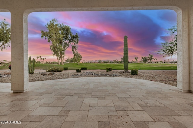 view of patio terrace at dusk