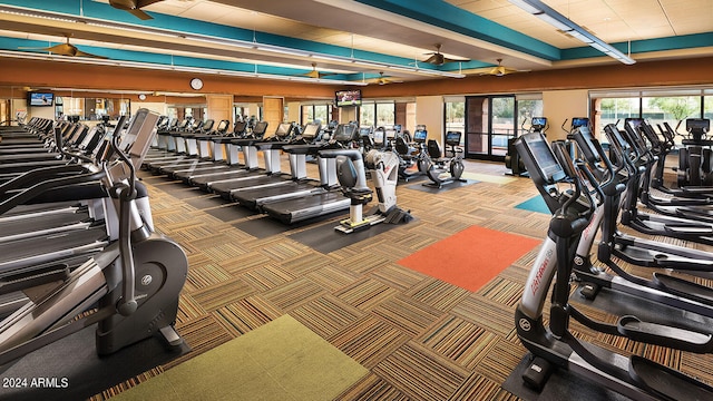 gym with carpet flooring and ceiling fan