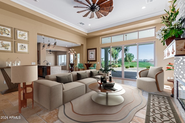 living room featuring crown molding and sink