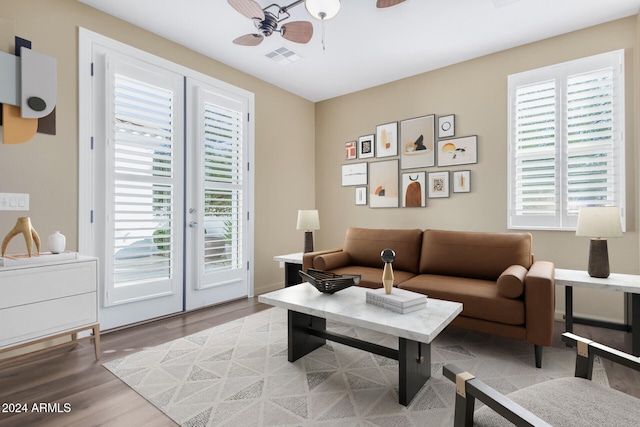 living room with hardwood / wood-style flooring, plenty of natural light, and ceiling fan