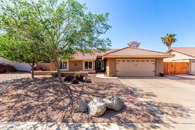 2753 E Kenwood St, Mesa, AZ 85213 - ranch-style home featuring stucco siding, driveway, an attached garage, a tile roof, and fence