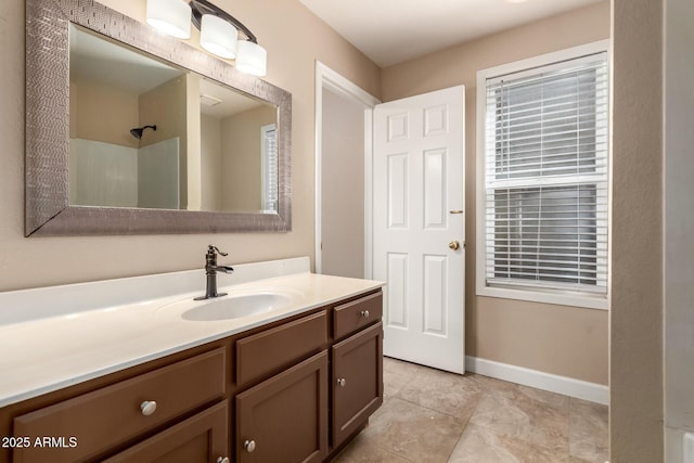 2753 E Kenwood St, Mesa, AZ 85213 - bathroom featuring tile patterned floors, baseboards, a shower, and vanity