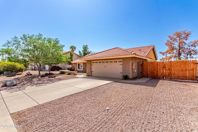 2753 E Kenwood St, Mesa, AZ 85213 - ranch-style home with a tiled roof, an attached garage, fence, concrete driveway, and stucco siding
