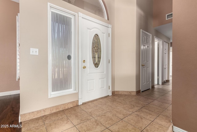 2753 E Kenwood St, Mesa, AZ 85213 - entryway featuring a high ceiling, light tile patterned floors, baseboards, and visible vents