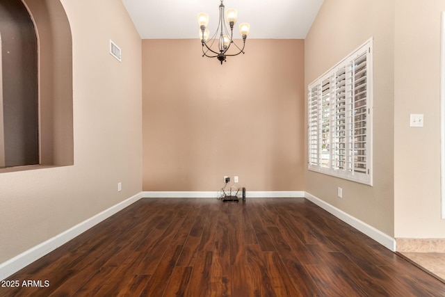 2753 E Kenwood St, Mesa, AZ 85213 - unfurnished dining area with a chandelier, baseboards, dark wood finished floors, and visible vents