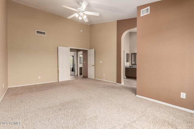 2753 E Kenwood St, Mesa, AZ 85213 - spare room with arched walkways, visible vents, light colored carpet, and a ceiling fan