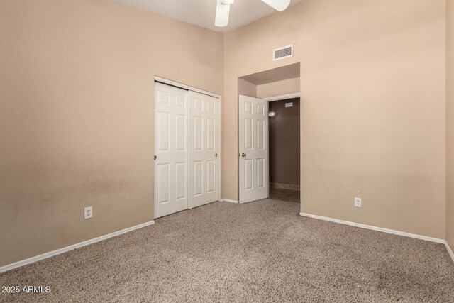 2753 E Kenwood St, Mesa, AZ 85213 - unfurnished bedroom featuring a closet, visible vents, carpet floors, a high ceiling, and baseboards
