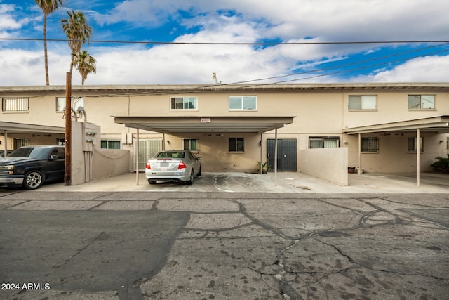 view of front of property featuring a carport