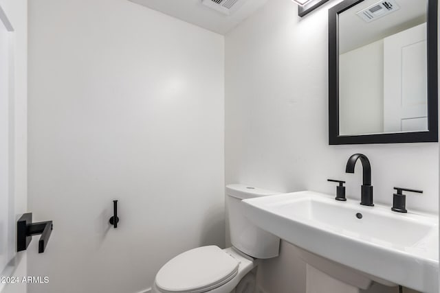 bathroom with sink and toilet