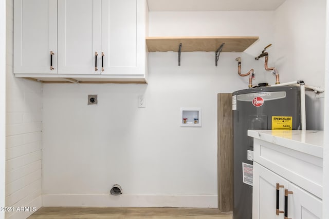 washroom with cabinets, hookup for a washing machine, light wood-type flooring, electric dryer hookup, and water heater