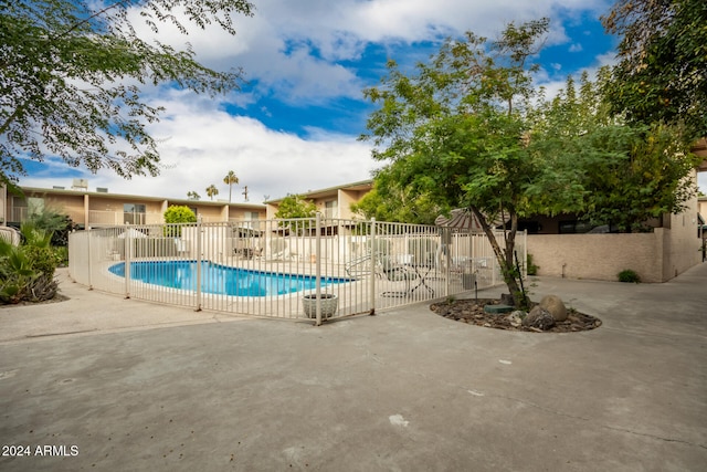 view of swimming pool with a patio area