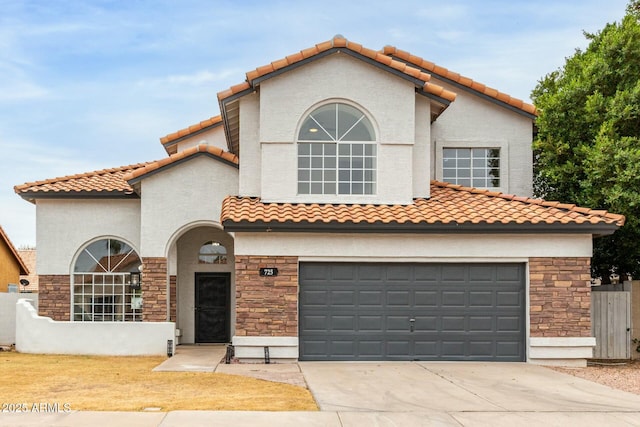 mediterranean / spanish-style home featuring a garage