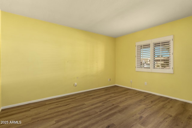 empty room with wood-type flooring