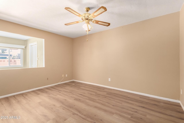 unfurnished room featuring light hardwood / wood-style flooring and ceiling fan