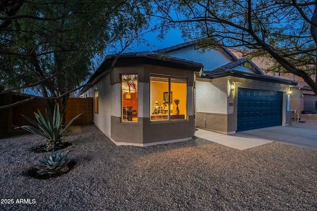 view of front of property with a garage