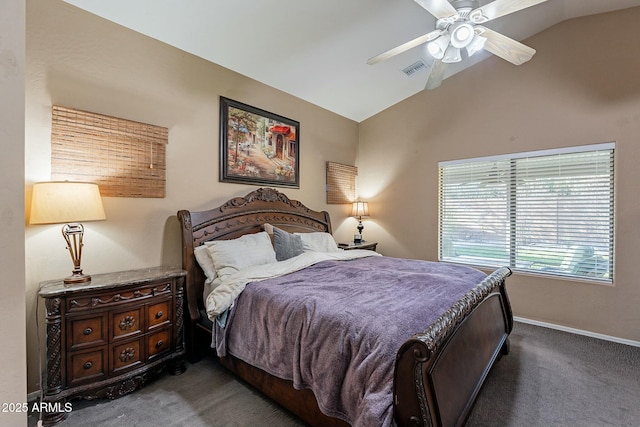 bedroom featuring dark colored carpet, vaulted ceiling, and ceiling fan