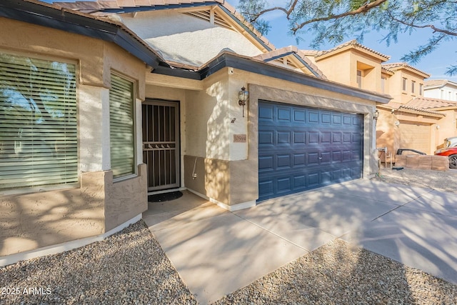 doorway to property featuring a garage