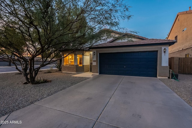 ranch-style home with a garage