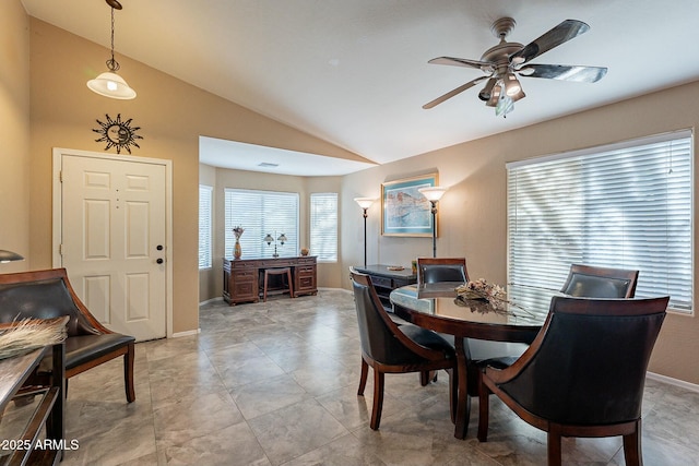 dining space featuring vaulted ceiling and ceiling fan