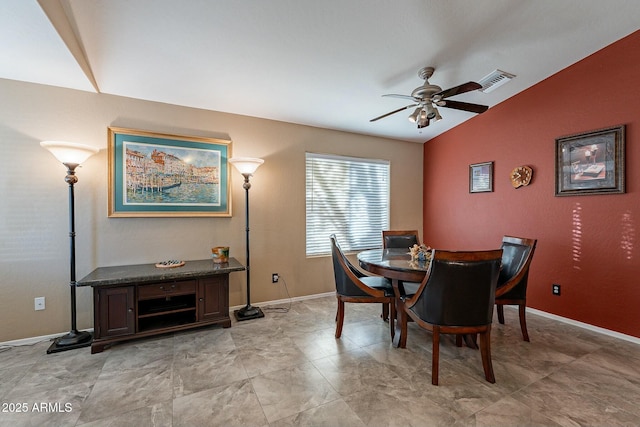 dining space featuring vaulted ceiling and ceiling fan