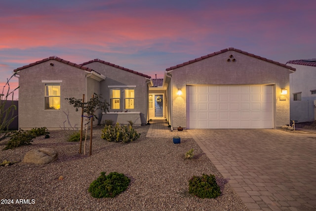 mediterranean / spanish-style home featuring a garage