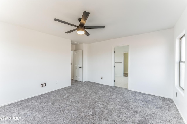 unfurnished bedroom with ceiling fan and carpet floors