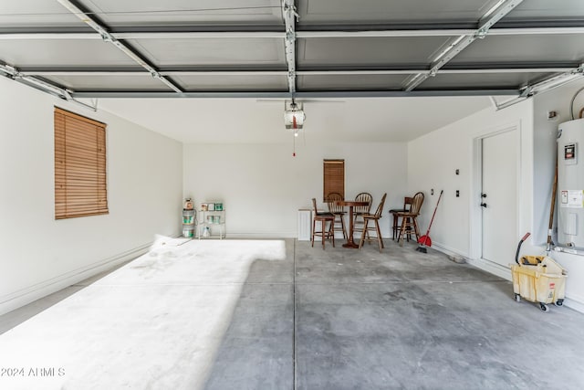 garage with water heater and a garage door opener