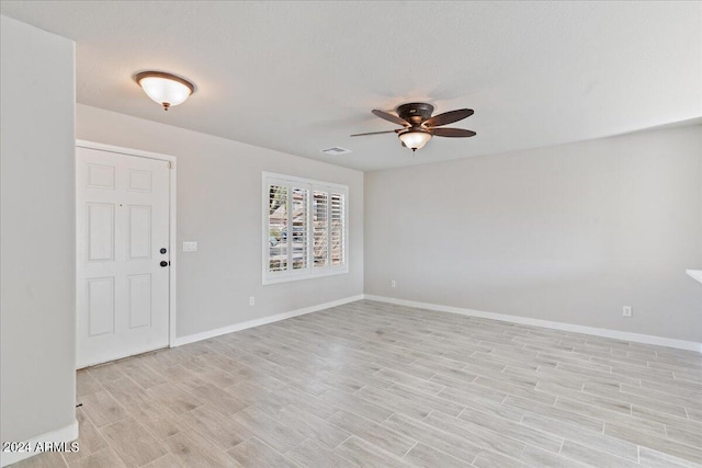 unfurnished room featuring ceiling fan and light hardwood / wood-style flooring