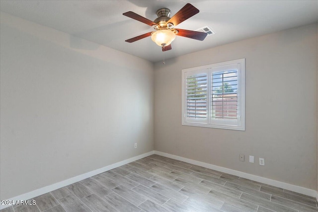 empty room with light hardwood / wood-style floors and ceiling fan