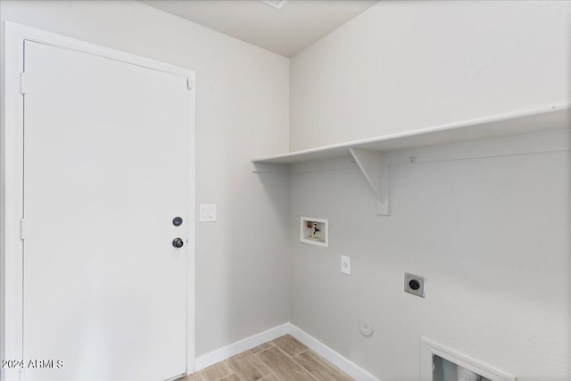 laundry room featuring light hardwood / wood-style flooring, electric dryer hookup, washer hookup, and gas dryer hookup