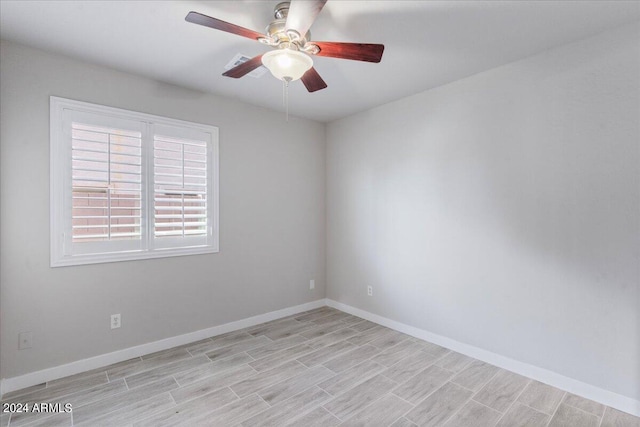 spare room with ceiling fan and light hardwood / wood-style floors