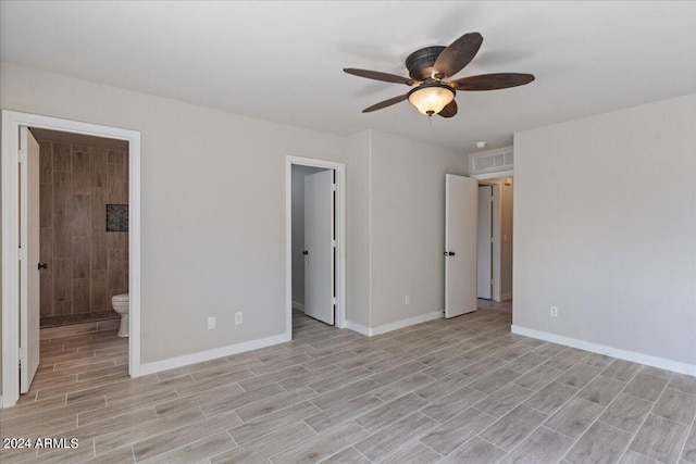 unfurnished bedroom with light hardwood / wood-style floors, connected bathroom, and ceiling fan