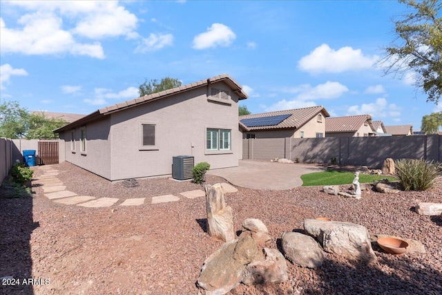 back of house featuring a patio area and central air condition unit