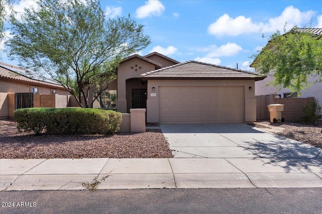 view of front of property with a garage