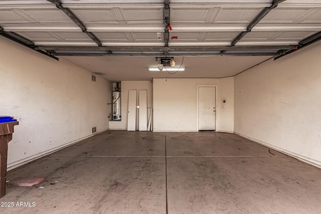 garage with a garage door opener and water heater