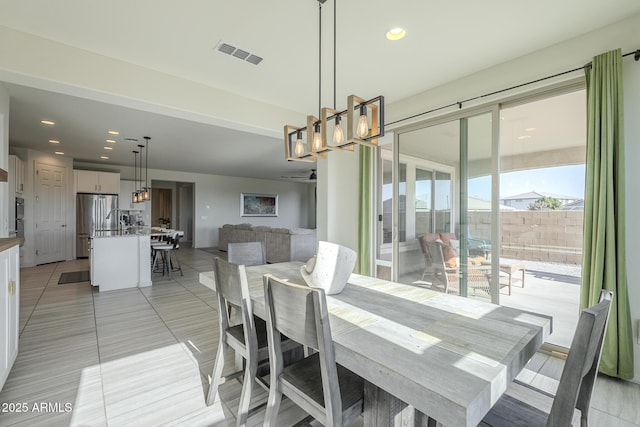 dining space featuring light tile patterned floors