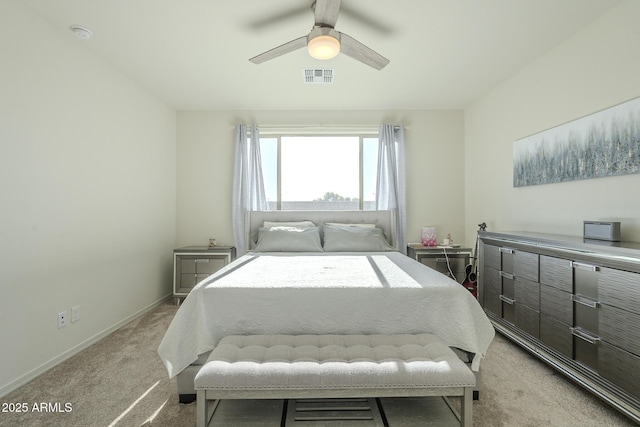 bedroom with ceiling fan and light carpet