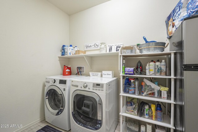 washroom with washer and dryer