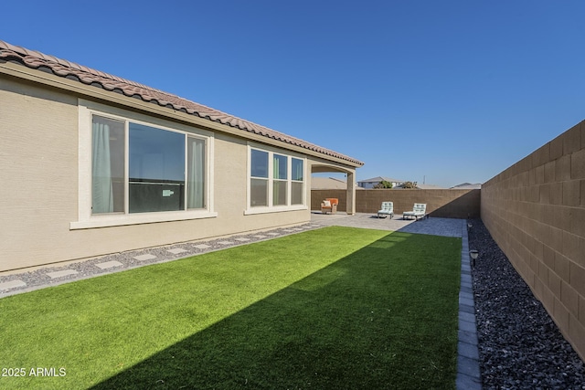 view of yard with a patio area