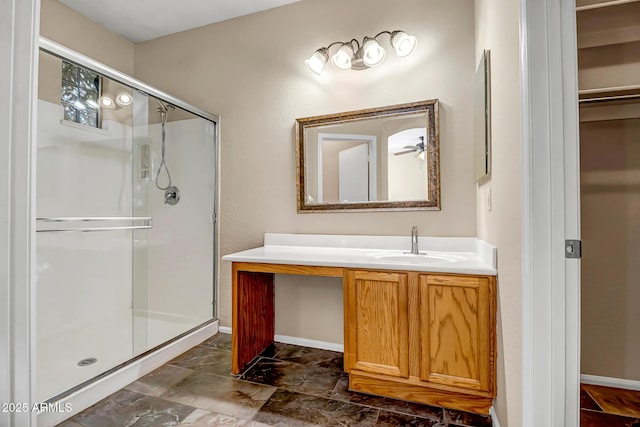 bathroom featuring vanity and an enclosed shower