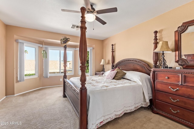 bedroom with light carpet and ceiling fan