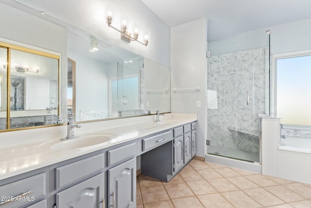 bathroom featuring tile patterned floors, vanity, and shower with separate bathtub