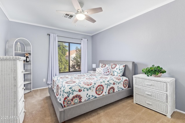 bedroom with ornamental molding, light colored carpet, and ceiling fan